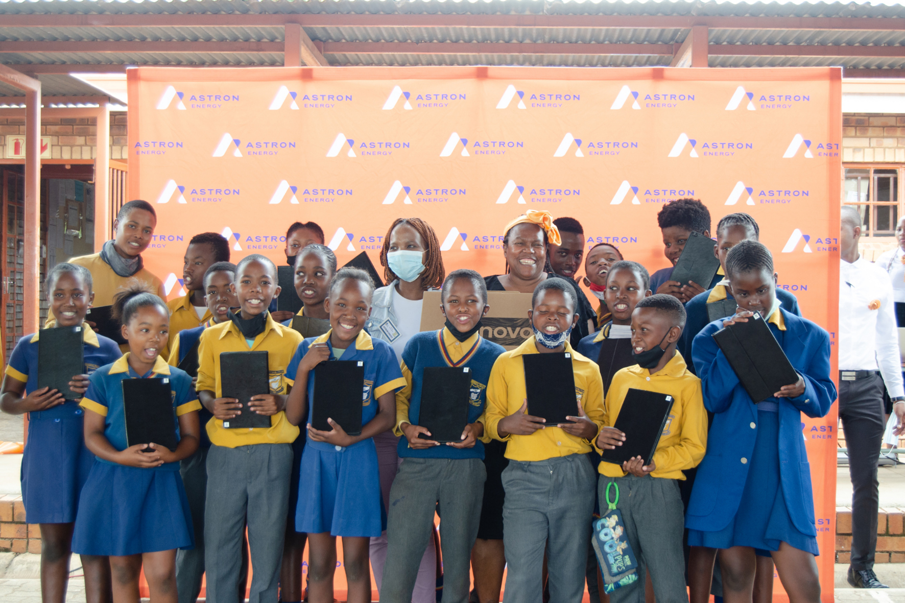 Learners receiving tablets